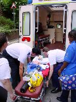 Max being loaded onto the ambulance
