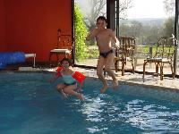 Dan & Emilie jumping into the pool
