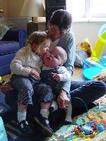 Jasmine (on Jo's lap) kissing Max