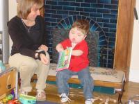 Max reading book on stool (with Denise)