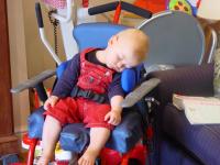 Luca asleep in Max\'s chair