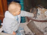 Luca playing in the fireplace