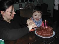 Max cutting his birthday cake