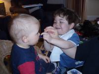 Max helping Mummy feed Luca
